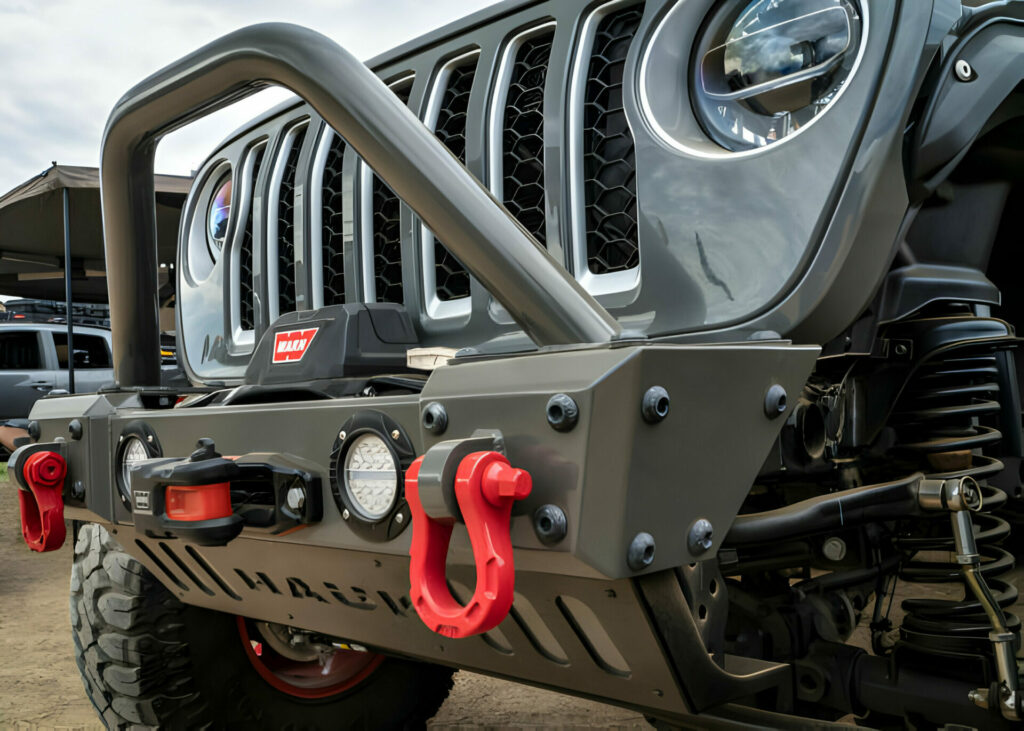 Loveland, CO, USA - August 26, 2022: Front bumper with Warn winch and grille of Jeep Wrangler equipped for seious off-road driving.