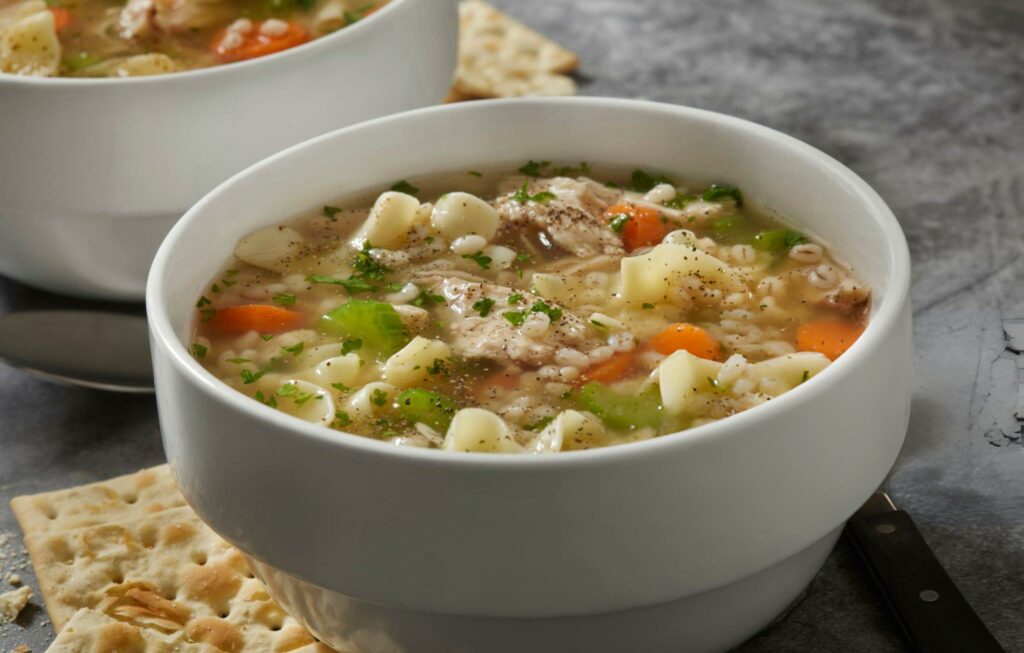 Chicken and Barley, Vegetable Noodle Soup with Onions, Carrots, Celery and Saltine Crackers