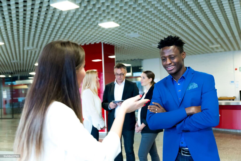 Business people in a lobby of a business building.