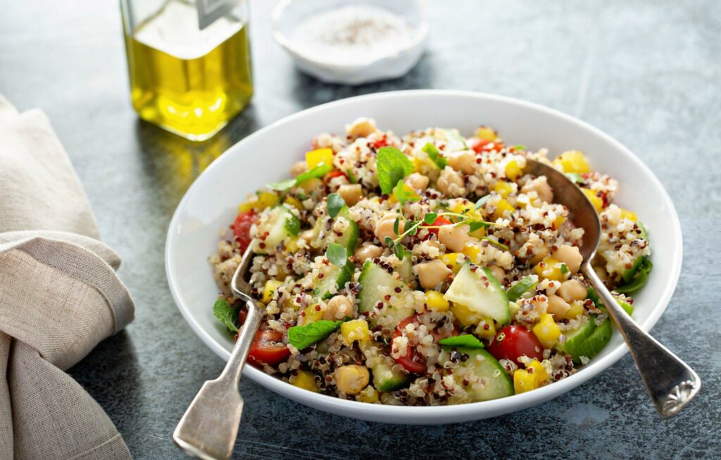 Fresh quinoa tabbouleh salad with tomatoes and cucumbers