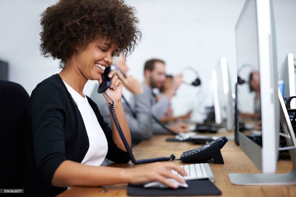 Shot of a woman working with her colleagues in the background