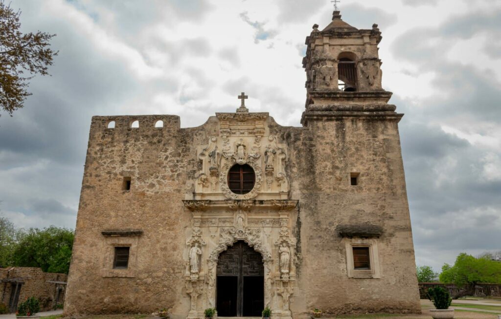 Architecture and exterior of an old San Antonio Texas mission San Jose on a cloudy day